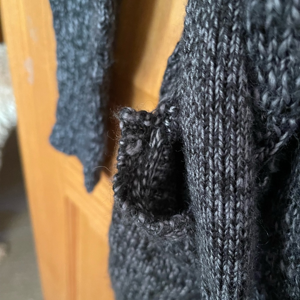 Eddie Bauer cardigan. Small tear right pocket can be sewn and still look new.